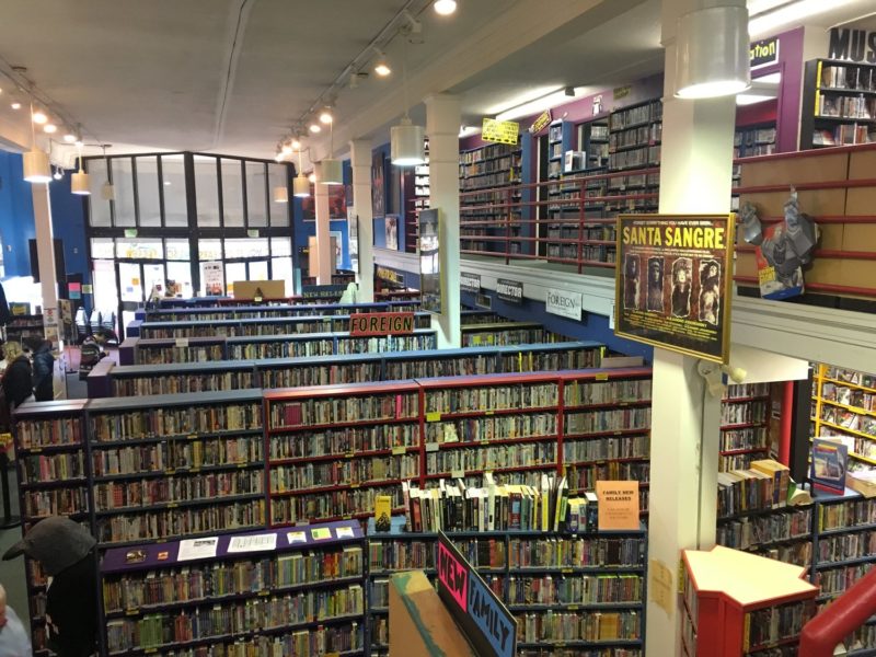 Interior of Scarecrow Video shows rows of shelves stocked with DVDs